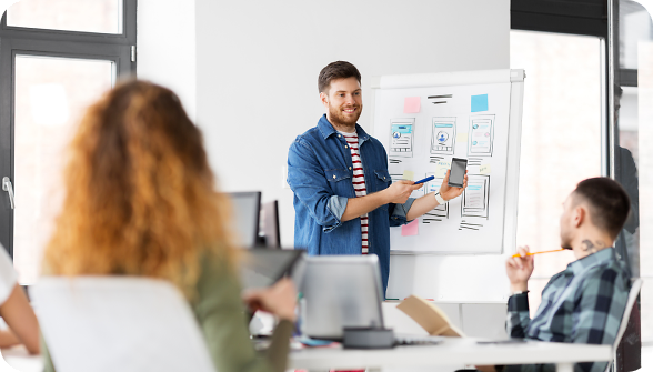 Man presenting phone website designs