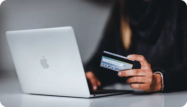 Lady purchasing on laptop