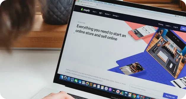 Laptop with a Shopify page on screen