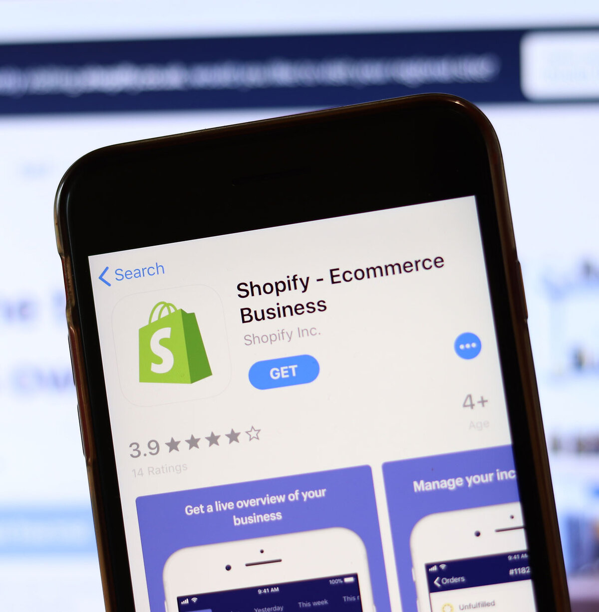Phone with Shopify icon on screen close up