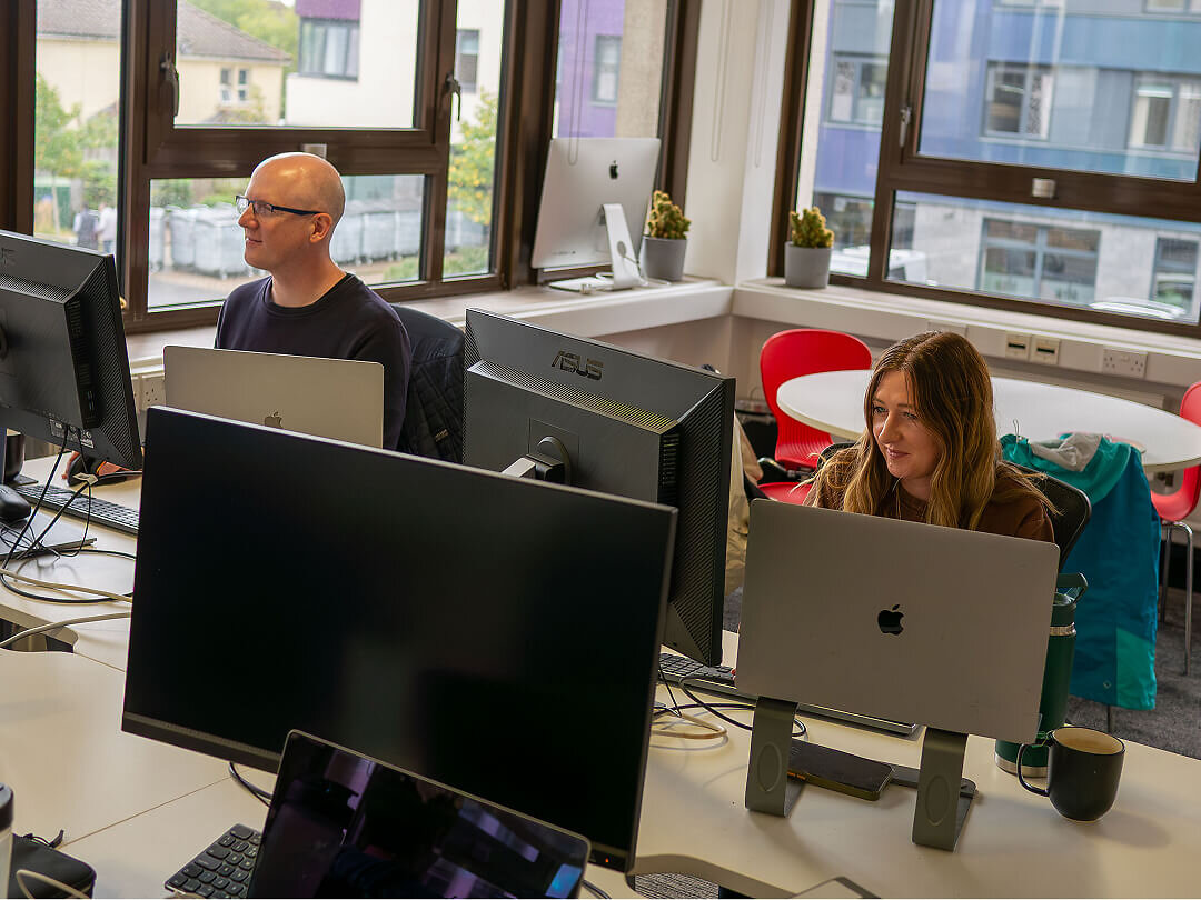 Envisage staff working at desk