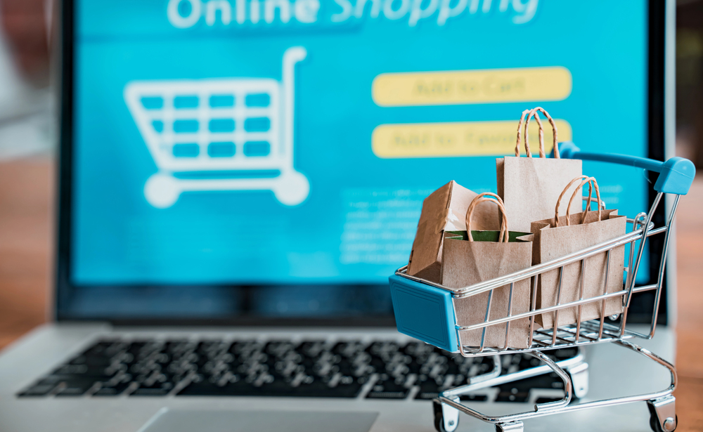 Trolley Next To Ecommerce Site On Laptop