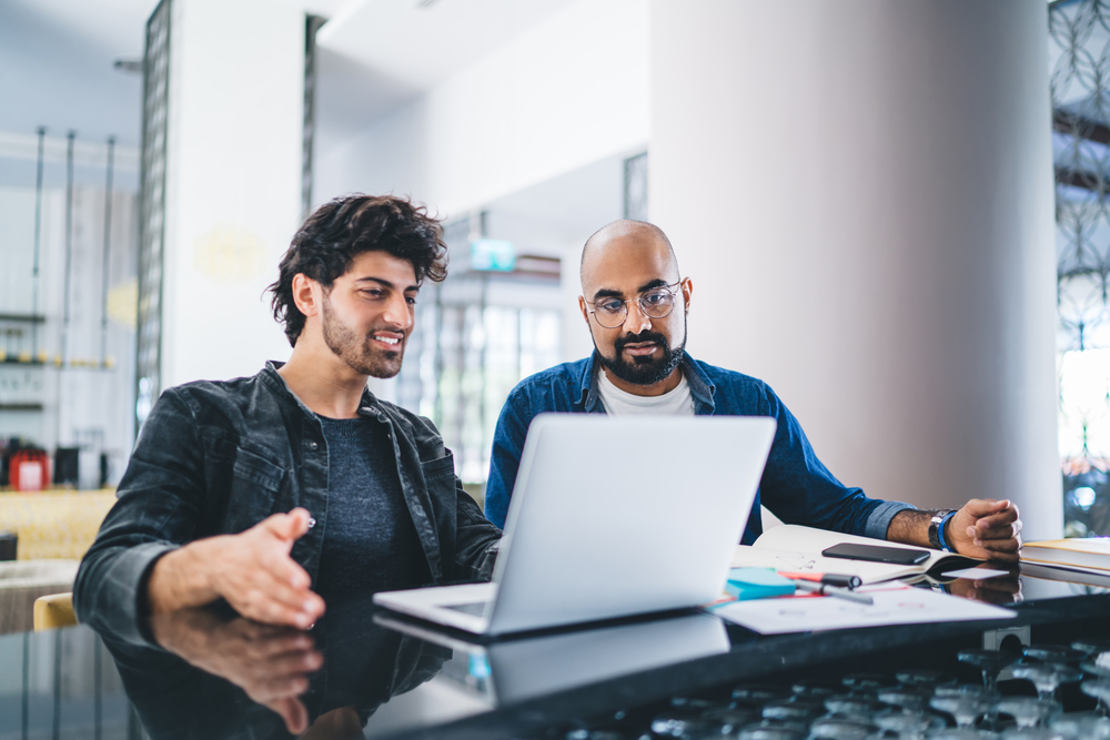 Cloud Hosting Developers Working On Laptop